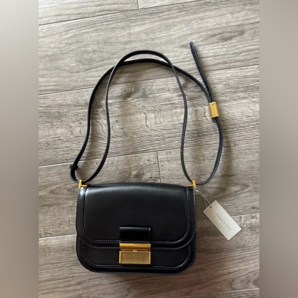 Charles & Keith Black Crossbody Bag with Gold Accents